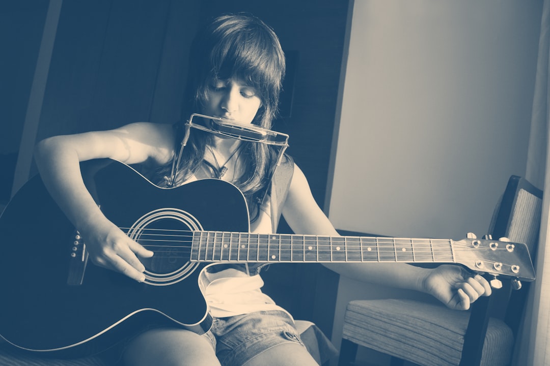 Photo playing acoustic guitar