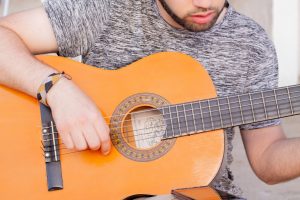Photo playing acoustic guitar
