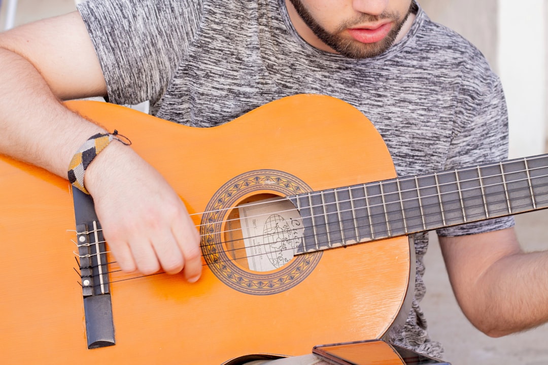 Photo playing acoustic guitar